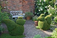 Terrace with chickens made of boxwood, Buxus 