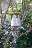 Feeding bell with long-tailed tits 