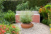 Mediterranean garden with tiled bench 