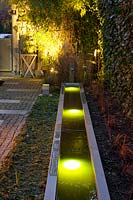 Light in the garden, illuminated water basin 