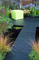 Modern terrace with pond, Campanula Prichards Variety, Achillea Terracotta, Imperata cylindrica Red Baron 