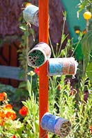 Insect hotel made from tin cans 