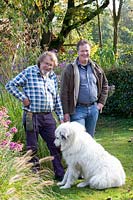 Garden owners Gisbert and Ralph Hüls with Pyrenean Mountain Dog Vito 