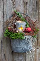 Arrangement with natural materials and lantern 
