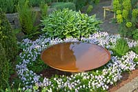 Bed with rust water bowl and thyme, Thymus longicaulis odoratus 