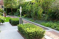Modern garden with yew trees 