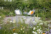 Insect-friendly garden with seating area 