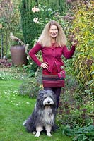 Garden owner Betina May with Bearded Collie Frido 
