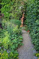 Gravel path in small garden 