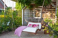 Arbor with swing lounger 