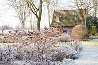 Bed with garden house in winter 