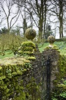 Mossy gateposts in the walled garden at Cerney House in March