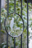 Symbol of the Gardeners' Royal Benevolent Fund, now called Perennial, in a gate at York Gate Garden