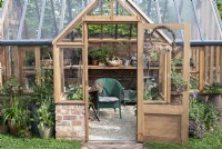 Greenhouse on the Eat, Drink and be Rosemary garden at RHS Malvern Spring Festival 2024. Designed by Laura Ashton-Phillips